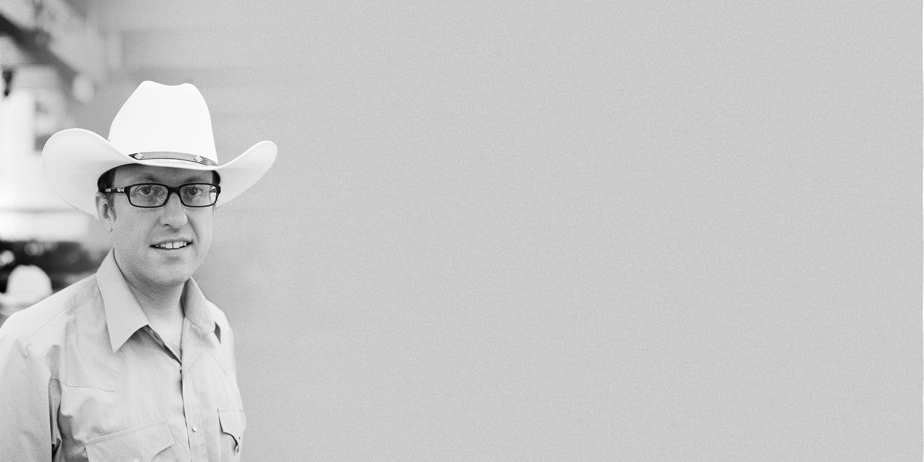 Brian Tomlin wearing a white cowoby hat